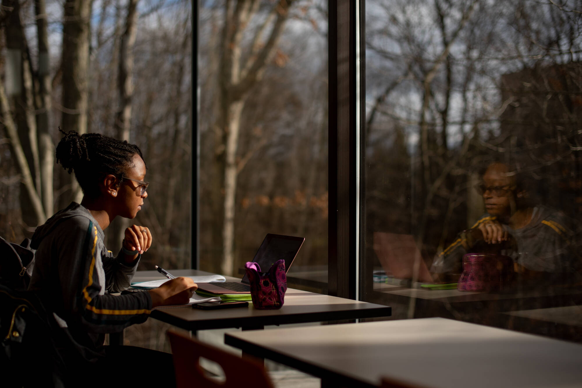 A student studies prior inside the Seidman House